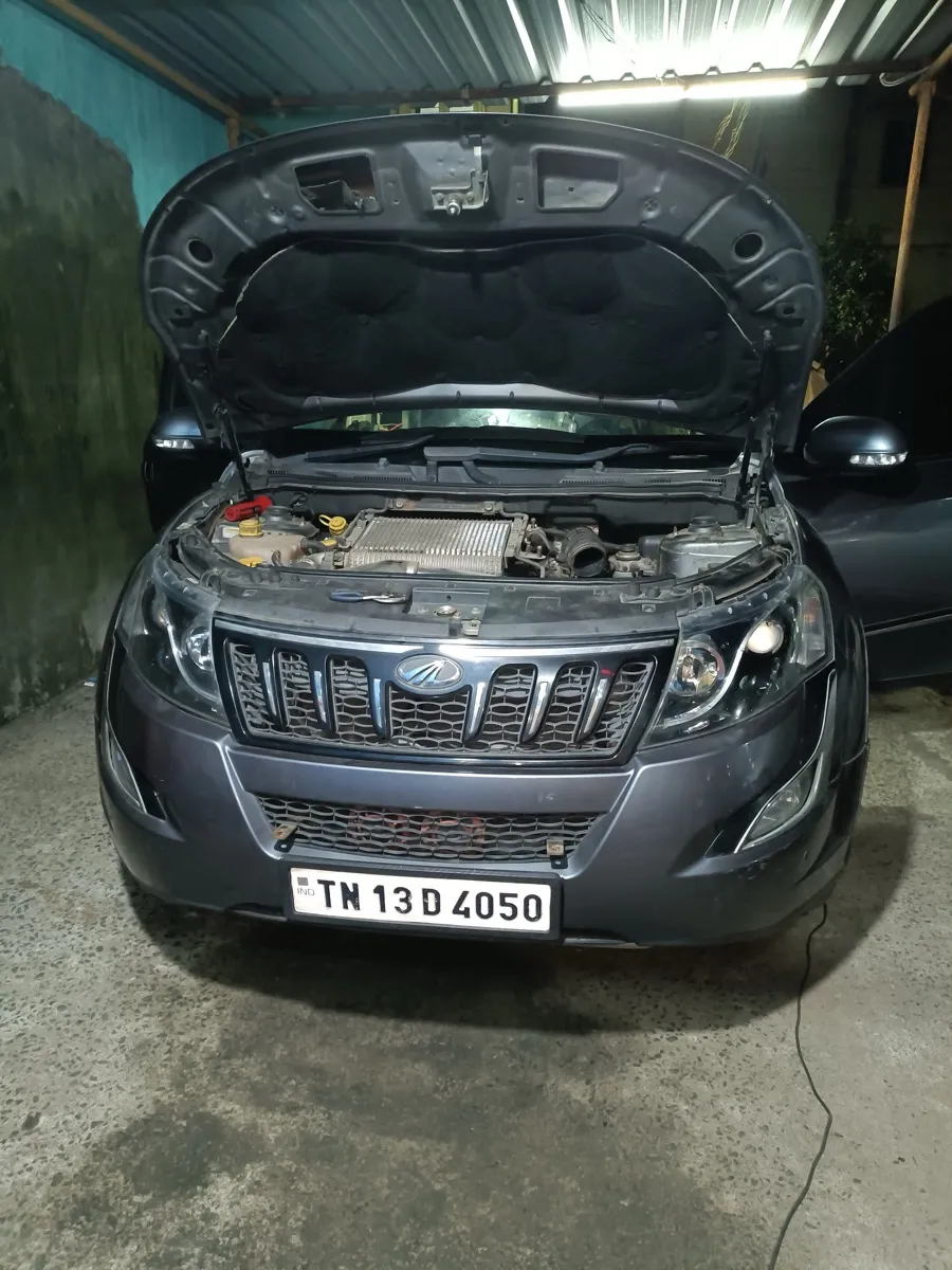 GM Car AC Service workshop — full view of service bay with vehicles under AC repair Chennai