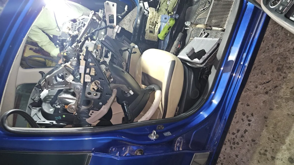 Auto AC installation for sedan — certified technician at work in GM Car AC workshop Chennai